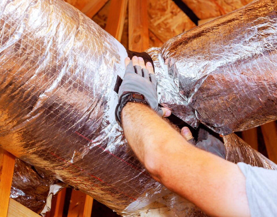 Ductwork Contractor, Worker,Adjusts,Insulation,Around,Ductwork,In,Residential,Attic,,Ensuring